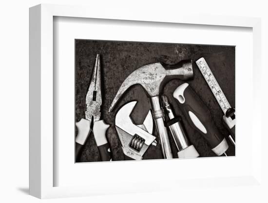 Black and White Image of a Set of Tools on a Textured Metallic Background-Kamira-Framed Photographic Print