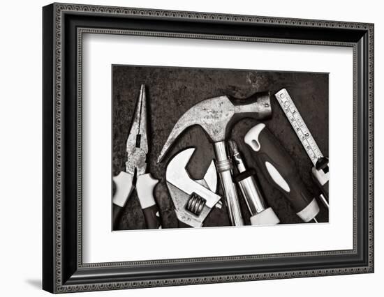 Black and White Image of a Set of Tools on a Textured Metallic Background-Kamira-Framed Photographic Print