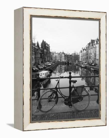 Black and White Image of an Old Bicycle by the Singel Canal, Amsterdam, Netherlands, Europe-Amanda Hall-Framed Premier Image Canvas