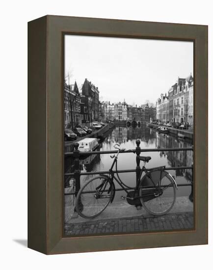 Black and White Image of an Old Bicycle by the Singel Canal, Amsterdam, Netherlands, Europe-Amanda Hall-Framed Premier Image Canvas