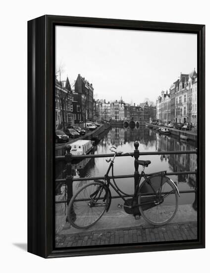 Black and White Image of an Old Bicycle by the Singel Canal, Amsterdam, Netherlands, Europe-Amanda Hall-Framed Premier Image Canvas