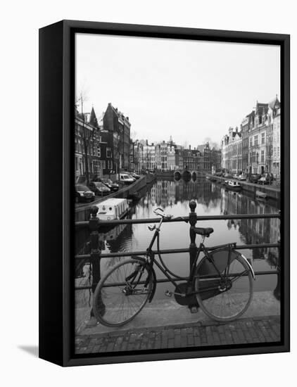 Black and White Image of an Old Bicycle by the Singel Canal, Amsterdam, Netherlands, Europe-Amanda Hall-Framed Premier Image Canvas