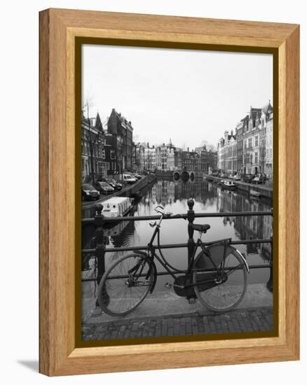 Black and White Image of an Old Bicycle by the Singel Canal, Amsterdam, Netherlands, Europe-Amanda Hall-Framed Premier Image Canvas