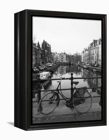 Black and White Image of an Old Bicycle by the Singel Canal, Amsterdam, Netherlands, Europe-Amanda Hall-Framed Premier Image Canvas