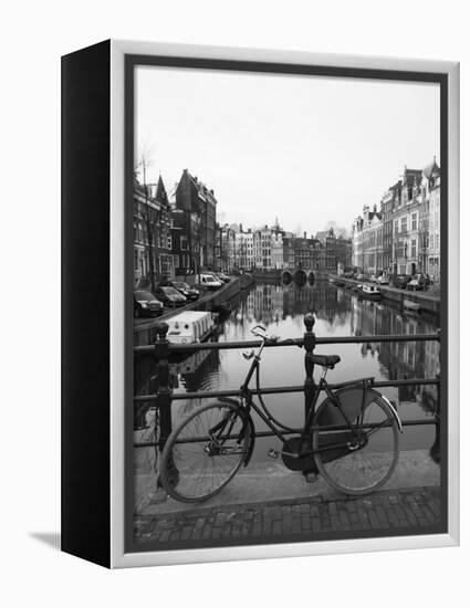 Black and White Image of an Old Bicycle by the Singel Canal, Amsterdam, Netherlands, Europe-Amanda Hall-Framed Premier Image Canvas