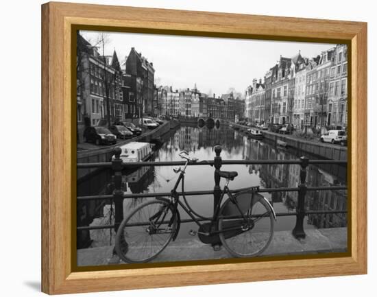 Black and White Imge of an Old Bicycle by the Singel Canal, Amsterdam, Netherlands, Europe-Amanda Hall-Framed Premier Image Canvas