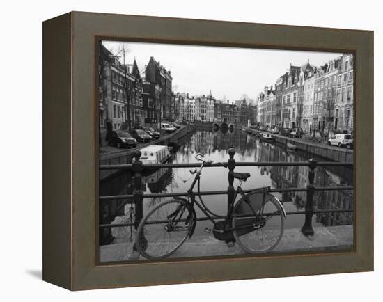 Black and White Imge of an Old Bicycle by the Singel Canal, Amsterdam, Netherlands, Europe-Amanda Hall-Framed Premier Image Canvas