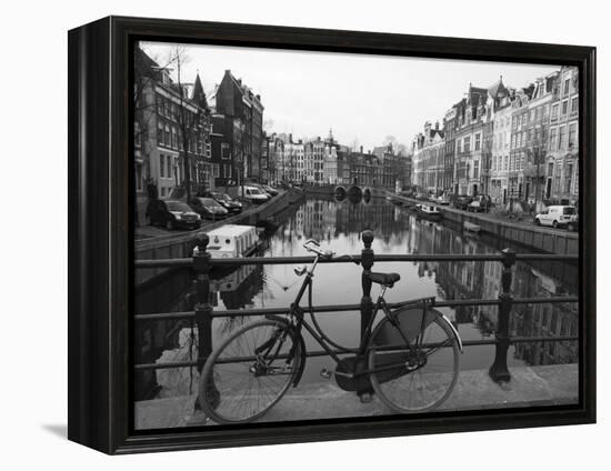 Black and White Imge of an Old Bicycle by the Singel Canal, Amsterdam, Netherlands, Europe-Amanda Hall-Framed Premier Image Canvas