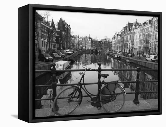 Black and White Imge of an Old Bicycle by the Singel Canal, Amsterdam, Netherlands, Europe-Amanda Hall-Framed Premier Image Canvas