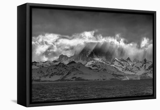 Black and white of South Georgia Island. Opening in clouds and Virga reveal the landscape.-Howie Garber-Framed Premier Image Canvas