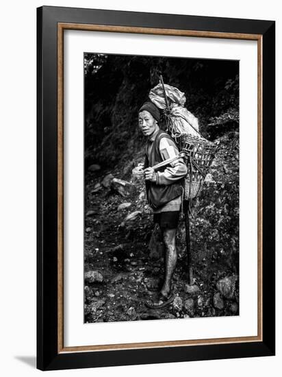 Black and white picture of a Sherpa carrying meat up to Everest Base Camp in Nepal-David Chang-Framed Photographic Print