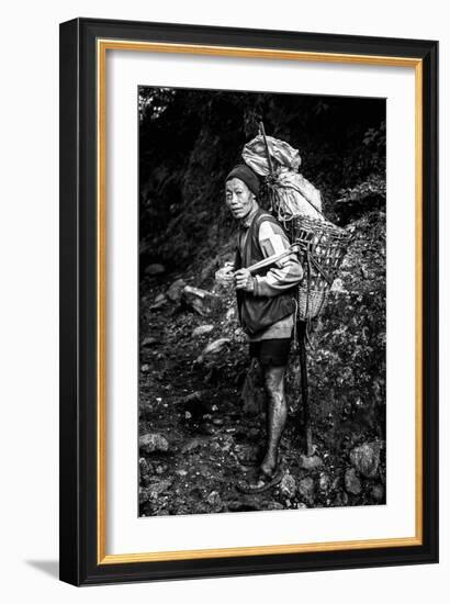 Black and white picture of a Sherpa carrying meat up to Everest Base Camp in Nepal-David Chang-Framed Photographic Print