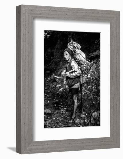 Black and white picture of a Sherpa carrying meat up to Everest Base Camp in Nepal-David Chang-Framed Photographic Print