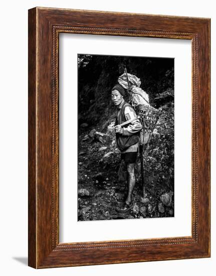 Black and white picture of a Sherpa carrying meat up to Everest Base Camp in Nepal-David Chang-Framed Photographic Print