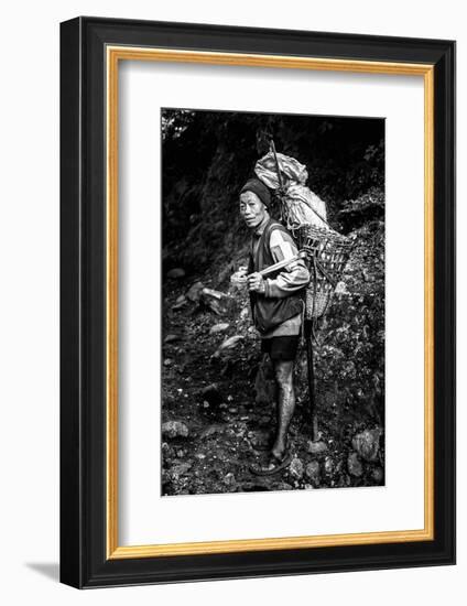 Black and white picture of a Sherpa carrying meat up to Everest Base Camp in Nepal-David Chang-Framed Photographic Print