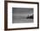 Black and White shot of a lone fisherman on rocks at the beach-null-Framed Photo