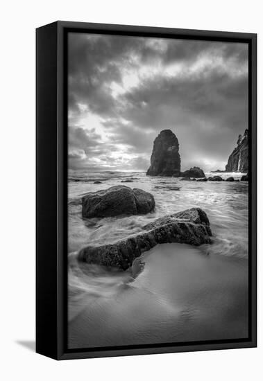 Black and white vertical of swirling water around rocks on a beach-Sheila Haddad-Framed Premier Image Canvas