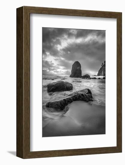 Black and white vertical of swirling water around rocks on a beach-Sheila Haddad-Framed Photographic Print