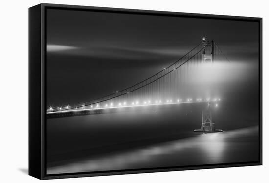 Black And White View Of The Golden Gate Bridge At Night With Silky Low Fog Around The Tower-Joe Azure-Framed Stretched Canvas