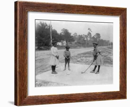 Black Children Playing Golf Photograph-Lantern Press-Framed Art Print