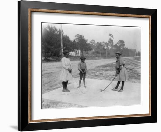 Black Children Playing Golf Photograph-Lantern Press-Framed Art Print