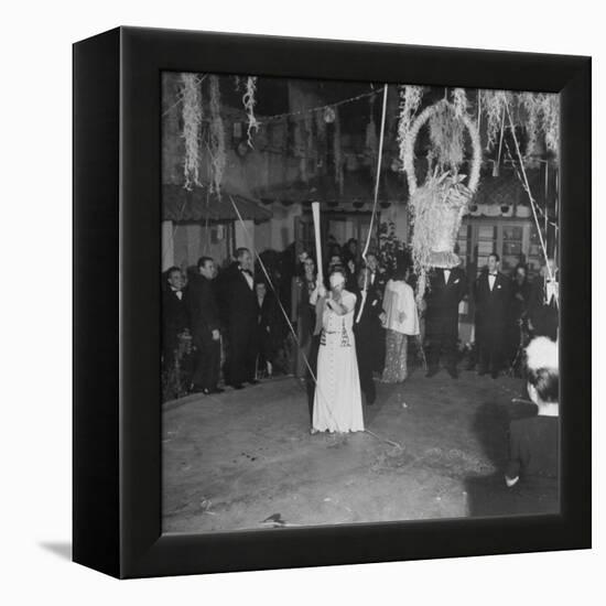 Blind Folded Woman Trying to Split Open the Pinata, During Traditional Pre-Christmas Celebration-Ed Clark-Framed Premier Image Canvas