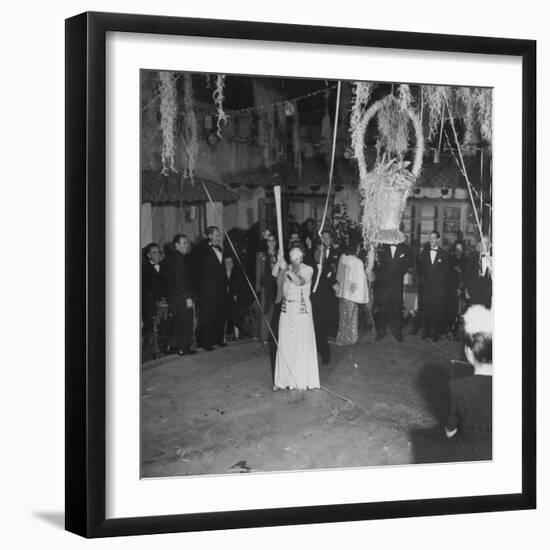 Blind Folded Woman Trying to Split Open the Pinata, During Traditional Pre-Christmas Celebration-Ed Clark-Framed Photographic Print
