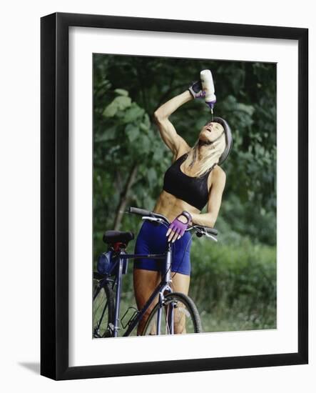 Blond Bicyclist Cooling Off with Bottled Water-null-Framed Photographic Print