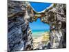 Blue and turquoise Sargasso Sea, glimpsed through an arch in the island's distinctive rocks-Barry Davis-Mounted Photographic Print