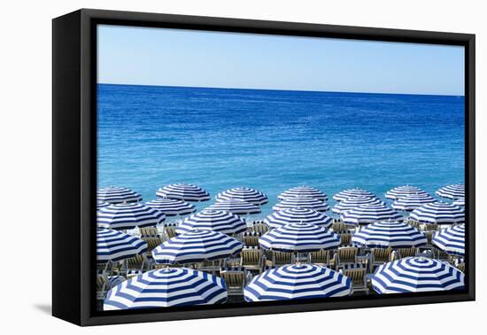 Blue and white beach parasols, Nice, Alpes Maritimes, Cote d'Azur, Provence, France, Mediterranean,-Fraser Hall-Framed Premier Image Canvas