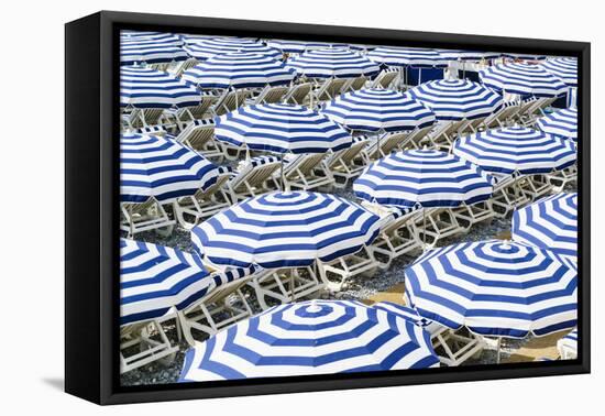 Blue and white beach parasols, Nice, Alpes Maritimes, Cote d'Azur, Provence, France, Mediterranean,-Fraser Hall-Framed Premier Image Canvas