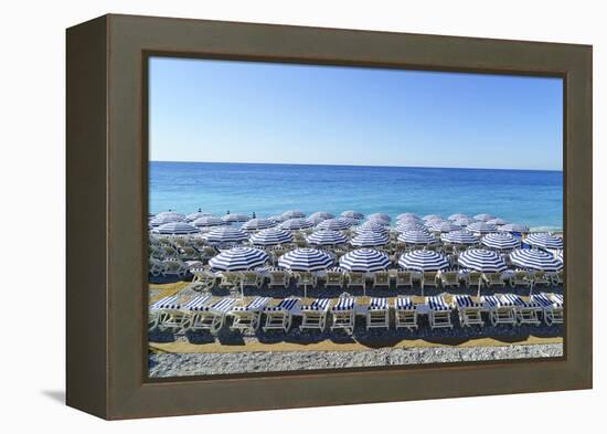 Blue and white beach parasols, Nice, Alpes-Maritimes, Cote d'Azur, Provence, French Riviera, France-Fraser Hall-Framed Premier Image Canvas