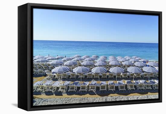 Blue and white beach parasols, Nice, Alpes-Maritimes, Cote d'Azur, Provence, French Riviera, France-Fraser Hall-Framed Premier Image Canvas