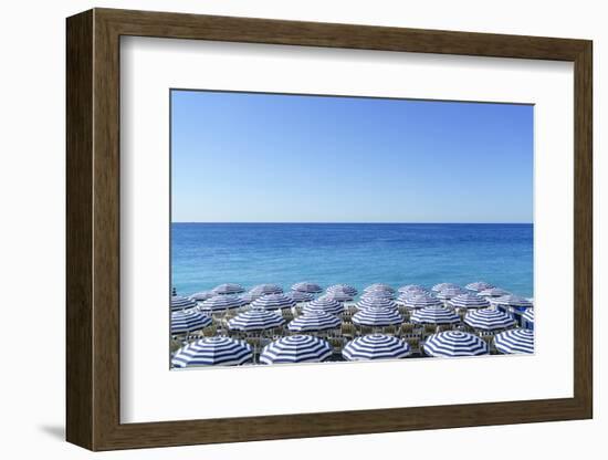 Blue and white beach parasols, Nice, Cote d'Azur, Alpes-Maritimes, Provence, French Riviera, France-Fraser Hall-Framed Photographic Print