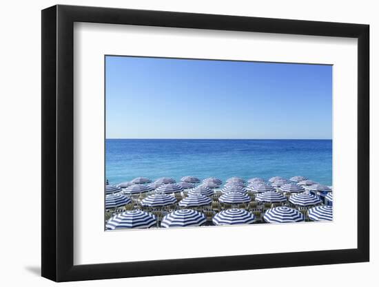 Blue and white beach parasols, Nice, Cote d'Azur, Alpes-Maritimes, Provence, French Riviera, France-Fraser Hall-Framed Photographic Print