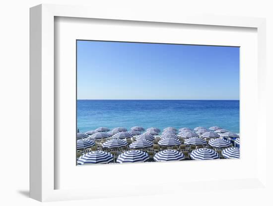 Blue and white beach parasols, Nice, Cote d'Azur, Alpes-Maritimes, Provence, French Riviera, France-Fraser Hall-Framed Photographic Print