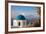 Blue domed Greek Orthodox church with bougainvillea flowers in Oia, Santorini, Greece.-Michele Niles-Framed Photographic Print