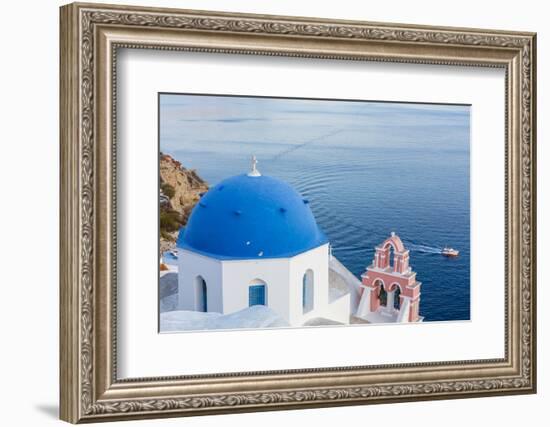 Blue domed white church overlooking boat in Aegean Sea, Santorini, Cyclades-Ed Hasler-Framed Photographic Print