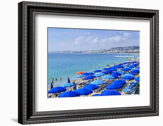 Blue parasols on the beach, Promenade des Anglais, Nice, Alpes Maritimes, Cote d'Azur, Provence, Fr-Fraser Hall-Framed Photographic Print