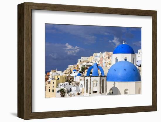 Blue Roofed Churches, Cities Embrace the Steep Mountain Sides, Santorini, Greece-Tom Norring-Framed Photographic Print