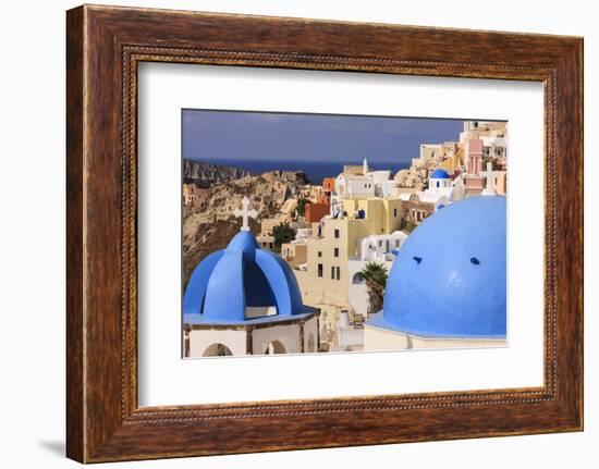 Blue Roofed Churches, Cities Embrace the Steep Mountain Sides, Santorini, Greece-Tom Norring-Framed Photographic Print