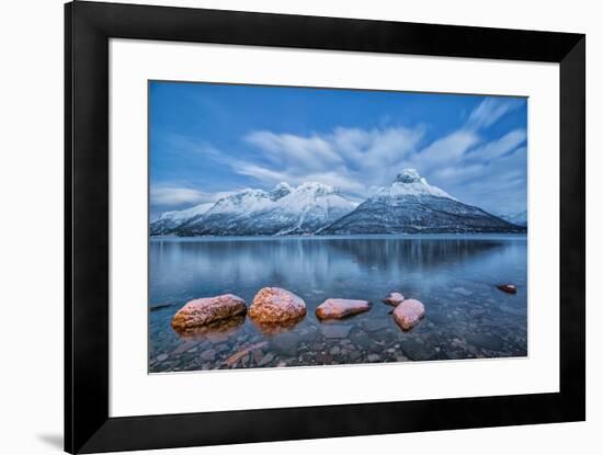 Blue sky at dusk and snowy peaks are reflected in the frozen sea at Oteren Storfjorden Lapland Lyng-ClickAlps-Framed Photographic Print