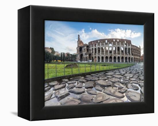 Blue sky at sunrise frames the ancient Colosseum (Flavian Amphitheatre), UNESCO World Heritage Site-Roberto Moiola-Framed Premier Image Canvas