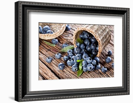 Blueberries Have Dropped from the Basket on an Old Wooden Table.-Volff-Framed Photographic Print