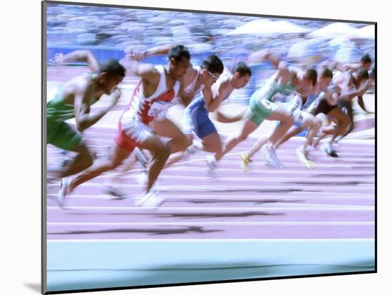 Blured Action at the Start of a Mens 100 Meter Track and Field Race-Paul Sutton-Mounted Photographic Print