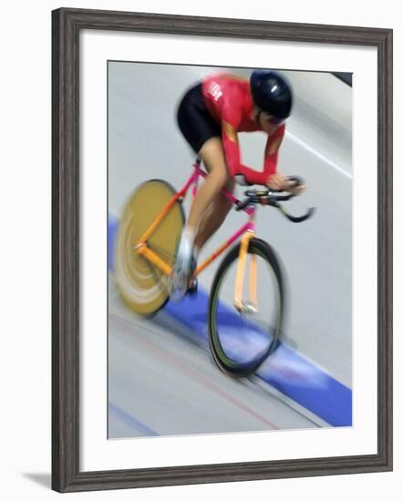 Blured Action of Female Cyclist Competing on the Velodrome-null-Framed Photographic Print