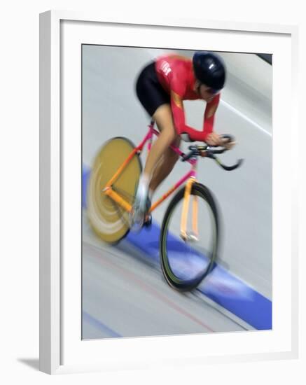 Blured Action of Female Cyclist Competing on the Velodrome-null-Framed Photographic Print