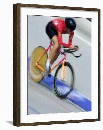 Blured Action of Female Cyclist Competing on the Velodrome-null-Framed Photographic Print