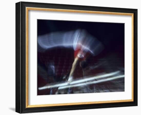 Blurred Action of Male Gymnast on the Parallel Bars-null-Framed Photographic Print