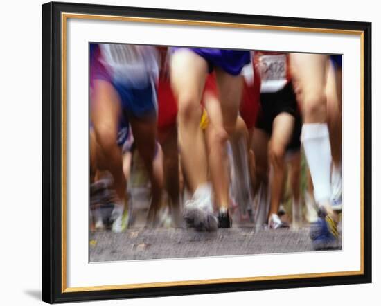 Blurred Action of Runner's Legs Competing in a Race-null-Framed Photographic Print